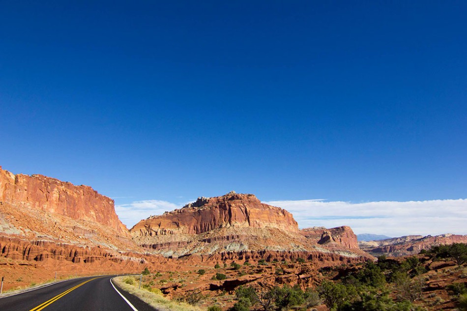 Scenic Byway 24 winding through massive red rocks
